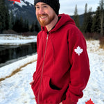 Full Zip red Hoodie with white canada maple leaf logo on left arm.