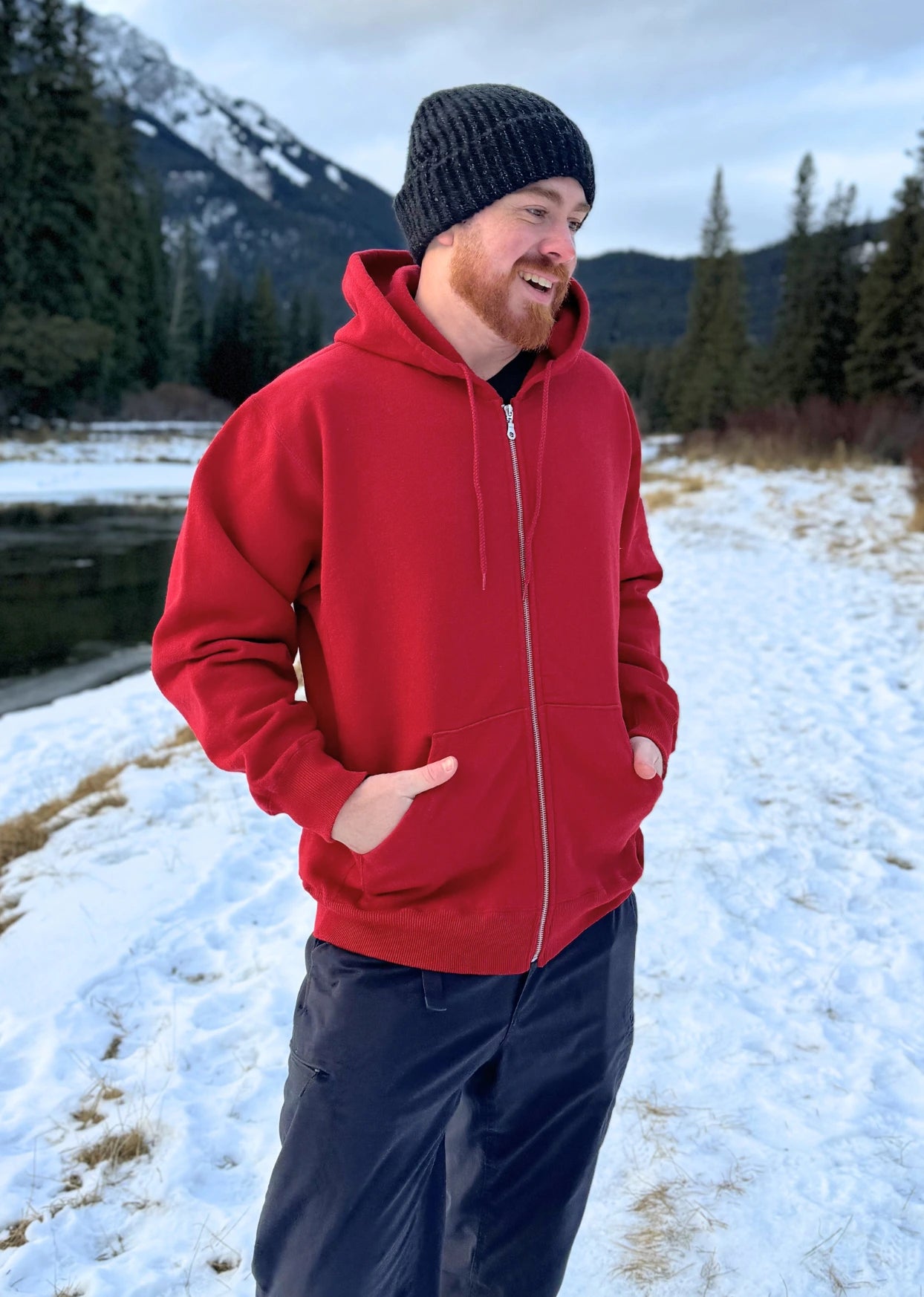 Full Zip red Hoodie with white canada maple leaf logo on left arm.