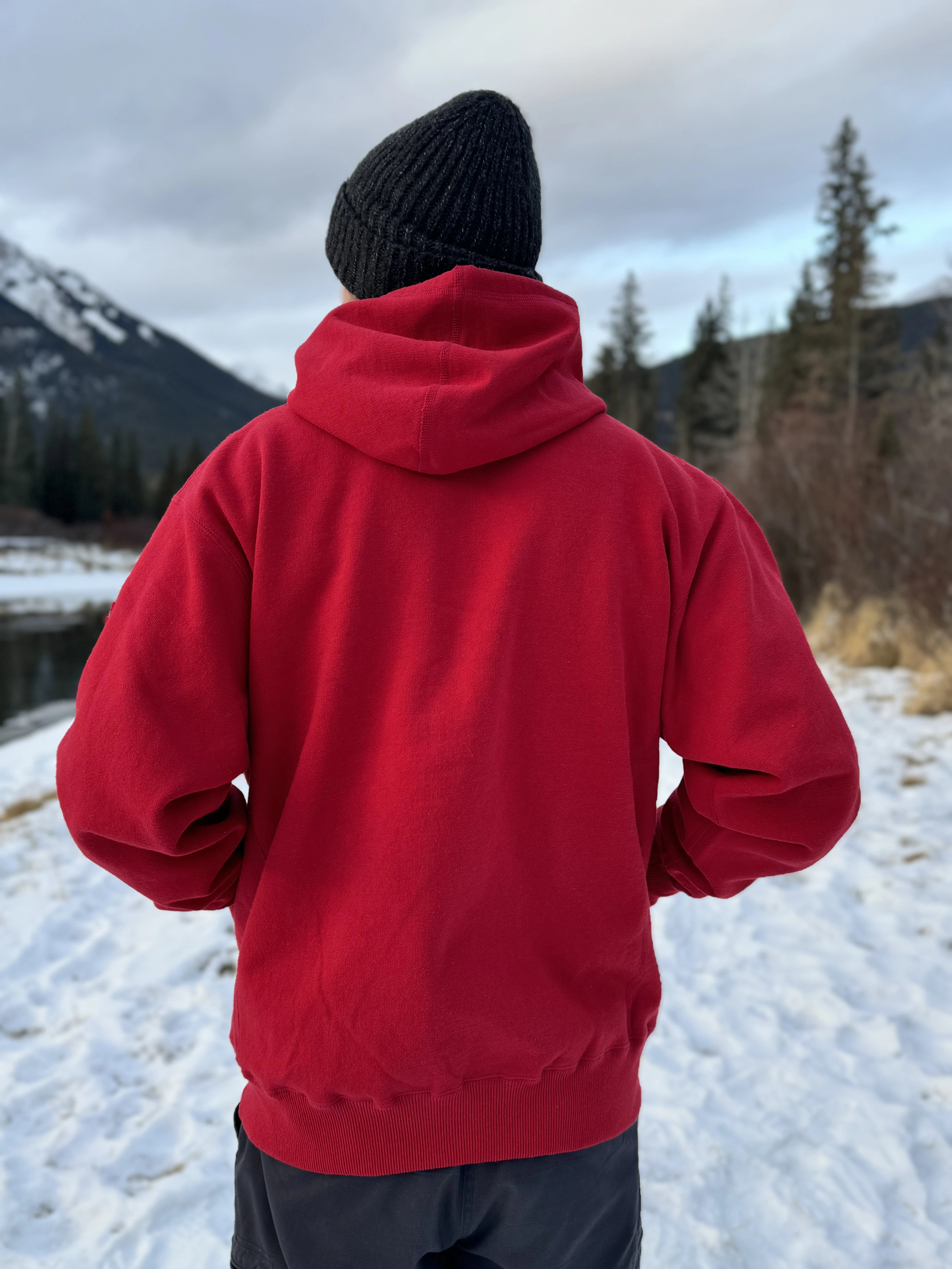 Full Zip red Hoodie with white canada maple leaf logo on left arm.